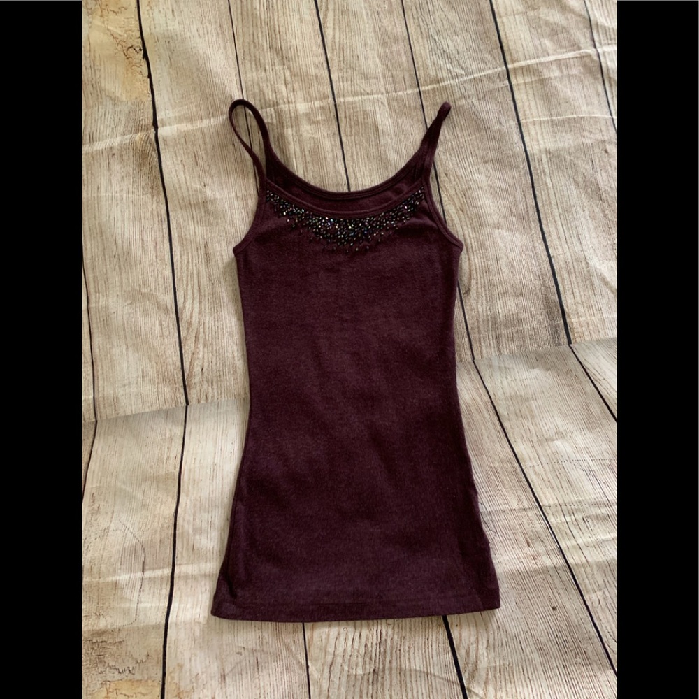 Burgundy top with spaghetti straps.